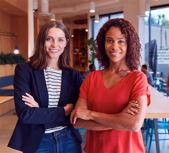 two women standing